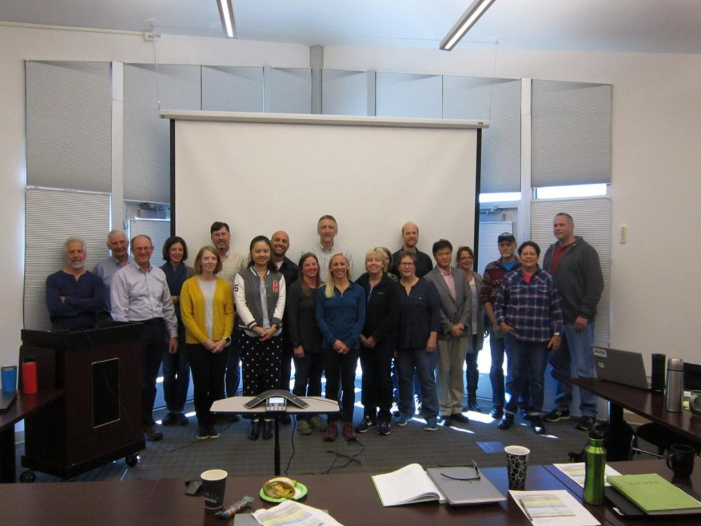 Group in front of projection screen