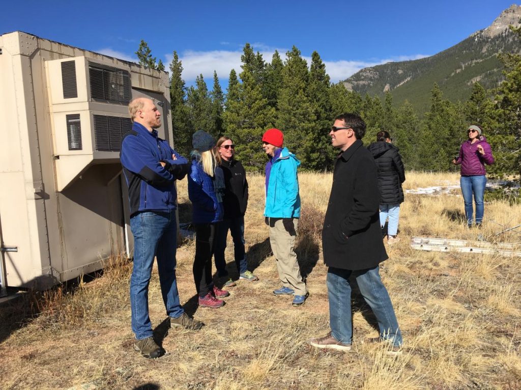 group discussing outside office