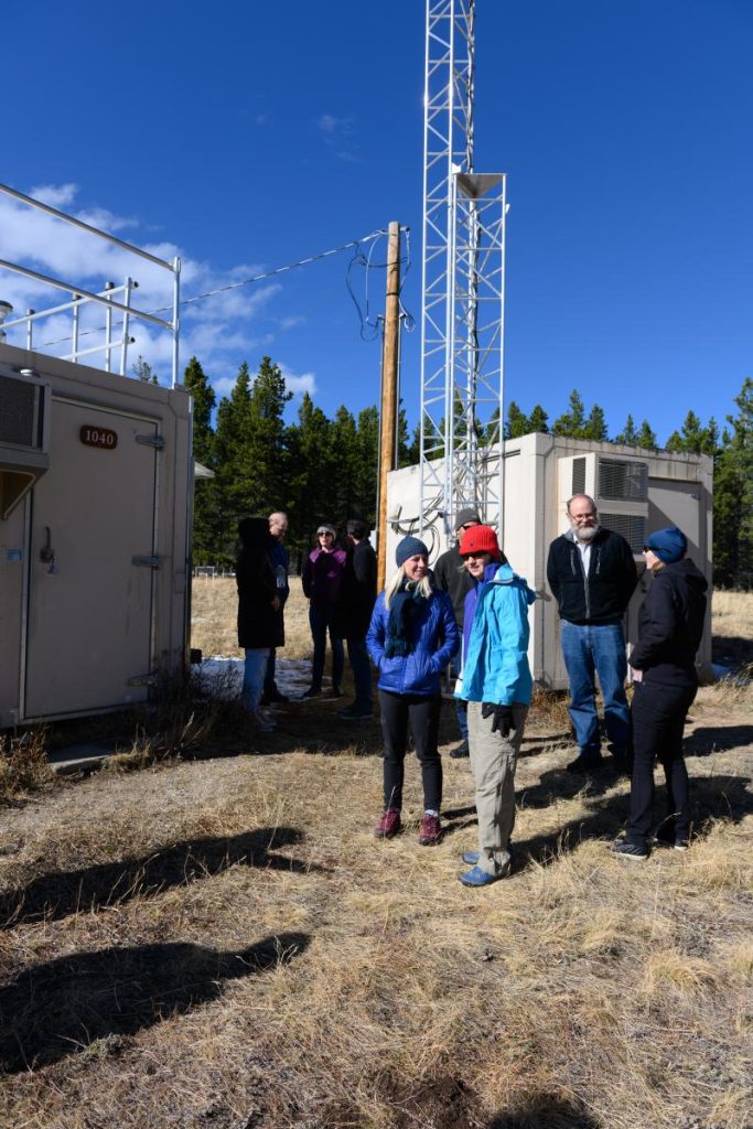 Jenny Hand and other attendees outside weather office